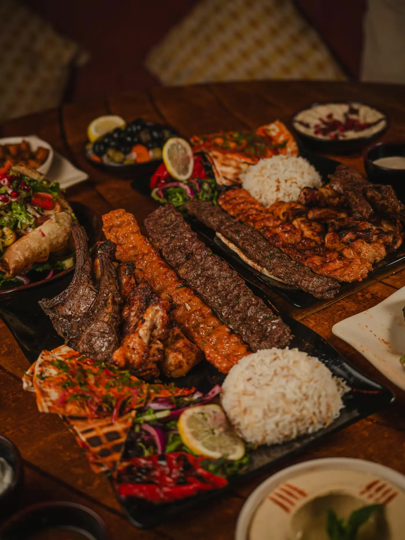 Feast table with mixed grills, rice and mezze plates at Beirut Restaurant, food photography by Gorka Di Capitan (gorkadicapitan.com)